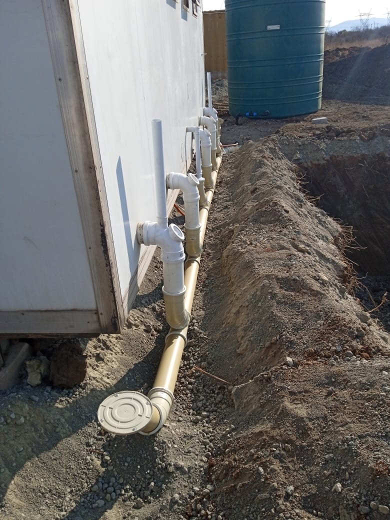 Drain laying and pipe installation for commercial building