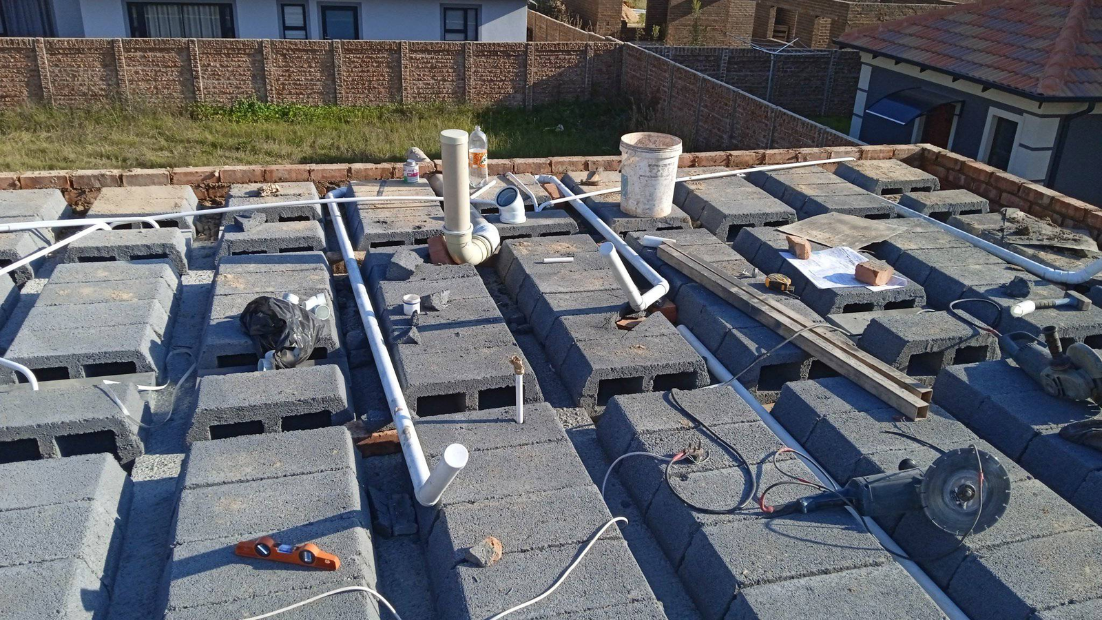 Roof plumbing and drainage pipe layout on construction site