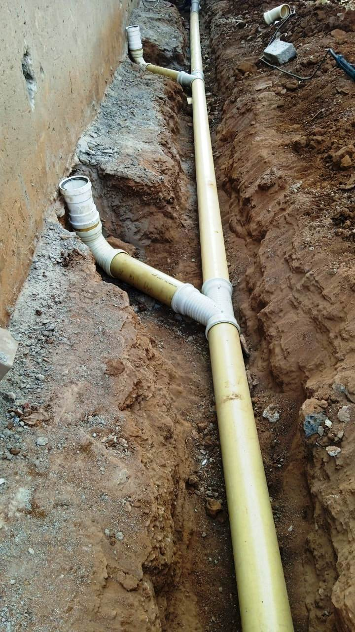 Sewer line and drainage pipe installation in trench